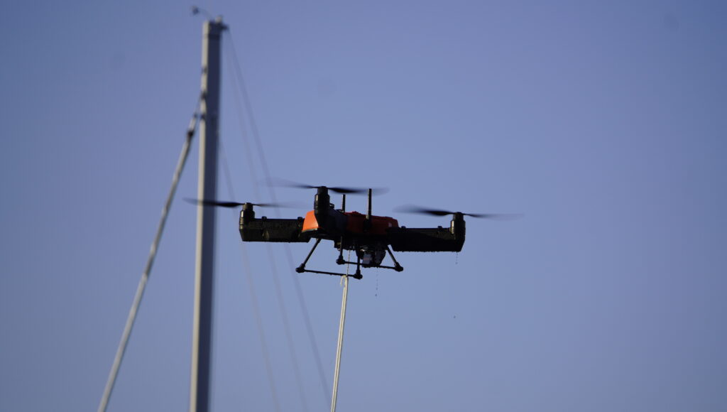 Flying near a boat mast with a bait line trailing below